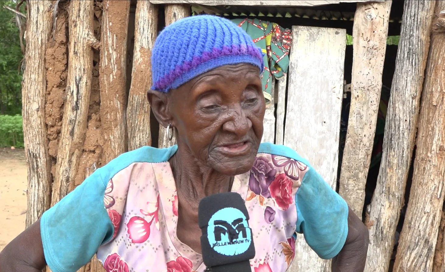 One of the affected Women displaced from her ancestral Land displays the structure built as an alternative.